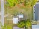 Aerial view of property showcasing the house, garage, and surrounding area at 118 E Palm Way, Edgewater, FL 32132