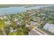 Wide aerial shot of the neighborhood with the property highlighted near the water at 118 E Palm Way, Edgewater, FL 32132