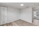 Open bedroom with hardwood floors and closet space at 118 E Palm Way, Edgewater, FL 32132