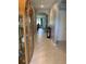 Inviting hallway featuring tile flooring, elegant archways, and seamless transition to living spaces at 123 Old Mill Pond Rd, Edgewater, FL 32141