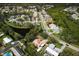 Aerial view showing the home's proximity to water and residential surroundings at 1240 Wayne Ave, New Smyrna Beach, FL 32168