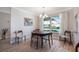 Cozy dining room features a window view and hardwood flooring at 1240 Wayne Ave, New Smyrna Beach, FL 32168