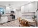 Bright kitchen featuring stainless steel appliances and ample counter space at 1240 Wayne Ave, New Smyrna Beach, FL 32168