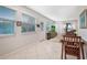 Bright living room with tiled floor, neutral wall colors, and natural light at 1240 Wayne Ave, New Smyrna Beach, FL 32168