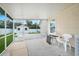 View of the screened patio with a shed visible from the backyard at 1240 Wayne Ave, New Smyrna Beach, FL 32168