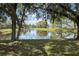 Scenic pond view showcasing the water and trees on a sunny day at 1240 Wayne Ave, New Smyrna Beach, FL 32168