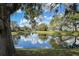 Scenic view of the pond and clear blue sky from the backyard at 1240 Wayne Ave, New Smyrna Beach, FL 32168