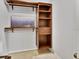 Well-organized closet with shelving and hanging space to maximize your storage, featuring a TV at 1462 General Mcarthur Ave, Daytona Beach, FL 32124