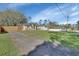 Home exterior with lawn and front entrance and backyard fence at 1462 General Mcarthur Ave, Daytona Beach, FL 32124