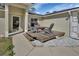 Front porch with outdoor seating on a small wooden deck with a stone border at 1462 General Mcarthur Ave, Daytona Beach, FL 32124