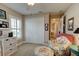 Serene bedroom with neutral tones, closet, and a cozy armchair for a peaceful retreat at 1502 Areca Palm Dr, Port Orange, FL 32128