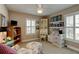 Bright bedroom with a ceiling fan, plantation shutters, and comfortable seating, creating a serene atmosphere at 1502 Areca Palm Dr, Port Orange, FL 32128