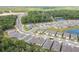 Aerial view of a new construction neighborhood nestled among trees and small lakes at 1731 Red Rock Rd, New Smyrna Beach, FL 32168