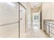 Bathroom featuring walk-in shower with glass door, tile floor and vanity with granite countertop at 1731 Red Rock Rd, New Smyrna Beach, FL 32168