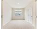 Empty bedroom with carpet and a window providing natural light at 1731 Red Rock Rd, New Smyrna Beach, FL 32168