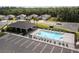 Community pool with lounge chairs, tables, and a covered area, perfect for relaxation at 1731 Red Rock Rd, New Smyrna Beach, FL 32168