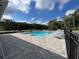 Inviting community pool with lounge chairs, clear water, and well-maintained brick pavers at 1731 Red Rock Rd, New Smyrna Beach, FL 32168