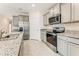 Contemporary kitchen featuring stainless steel appliances, granite countertops, and ample cabinet space at 1731 Red Rock Rd, New Smyrna Beach, FL 32168