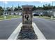 Stone sign for the community is surrounded by beautiful landscaping and new homes at 1731 Red Rock Rd, New Smyrna Beach, FL 32168