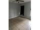 Bedroom showcasing tile flooring, neutral walls, and a ceiling fan for comfort at 1774 Concert Rd, Deltona, FL 32738