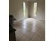 Bedroom features tiled floors and dual windows offering plenty of natural light at 1774 Concert Rd, Deltona, FL 32738