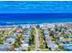 Coastal community aerial view featuring charming homes near the beach under a clear blue sky at 18 Silk Oaks Dr, Ormond Beach, FL 32176