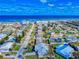 Coastal community aerial view featuring charming homes near the beach under a clear blue sky at 18 Silk Oaks Dr, Ormond Beach, FL 32176