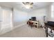 Office space featuring desk, rolling chair, computer, and a neutral patterned rug at 18 Silk Oaks Dr, Ormond Beach, FL 32176