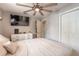 Bright bedroom with ceiling fan, built-in closet and lots of natural light at 254 Tanner St, New Smyrna Beach, FL 32168