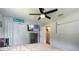 Comfortable bedroom featuring a ceiling fan, a closet and a TV on the wall at 254 Tanner St, New Smyrna Beach, FL 32168