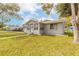 Well-kept single-story home with a tidy front yard, newer roof, and bright exterior paint at 254 Tanner St, New Smyrna Beach, FL 32168