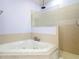 Bathroom featuring a corner jacuzzi tub and shower at 2590 Erena Dr, New Smyrna Beach, FL 32168