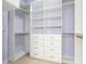 Walk-in closet with custom shelving and drawers for optimal organization at 2590 Erena Dr, New Smyrna Beach, FL 32168