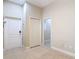 Hallway with tile flooring, closet, and access to multiple rooms at 2590 Erena Dr, New Smyrna Beach, FL 32168