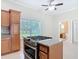 Kitchen island cooktop with granite counters overlooking living room and bathroom, great open layout at 2590 Erena Dr, New Smyrna Beach, FL 32168