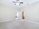 Neutral main bedroom with ensuite and neutral carpet at 2590 Erena Dr, New Smyrna Beach, FL 32168