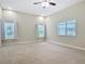 Spacious main bedroom with lots of light from the large windows at 2590 Erena Dr, New Smyrna Beach, FL 32168