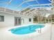 Private pool area with spa and covered enclosure at 2590 Erena Dr, New Smyrna Beach, FL 32168