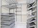 Organized walk-in closet with shelving and baskets for optimal storage at 2590 Erena Dr, New Smyrna Beach, FL 32168