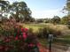 Scenic golf course view, showcasing lush green fairways and mature trees on a sunny day at 26 Birdie Dr, New Smyrna Beach, FL 32168