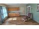 Cozy living room with beautiful wood flooring and light green walls providing ample space for relaxation at 26 Birdie Dr, New Smyrna Beach, FL 32168