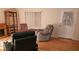 Living room featuring wood flooring and a sitting area at 26 Birdie Dr, New Smyrna Beach, FL 32168