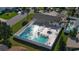 Aerial view of a community pool with lounge chairs and clear blue water at 26 Birdie Dr, New Smyrna Beach, FL 32168