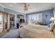 Lovely main bedroom with a ceiling fan, closet, and sliding glass door to the outside at 263 Minorca Beach Way # 801, New Smyrna Beach, FL 32169