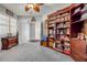 Home office with a large wooden bookcase, a ceiling fan, and neutral decor at 263 Minorca Beach Way # 801, New Smyrna Beach, FL 32169