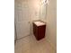 Cozy bathroom with a single sink vanity, neutral walls, and tiled floor, perfect for a guest at 2669 Sicily Dr, New Smyrna Beach, FL 32168