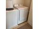 A laundry room featuring a front load washer and dryer at 2669 Sicily Dr, New Smyrna Beach, FL 32168