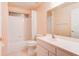 Cozy bathroom with a shower-tub combo, tile flooring, and vanity at 2708 Turnbull Estates Dr, New Smyrna Beach, FL 32168