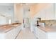 Bright kitchen featuring white appliances, tile backsplash, and ample counter space at 2708 Turnbull Estates Dr, New Smyrna Beach, FL 32168