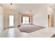 Bright living room featuring tile flooring, a large window, and an adjacent carpeted area at 2708 Turnbull Estates Dr, New Smyrna Beach, FL 32168